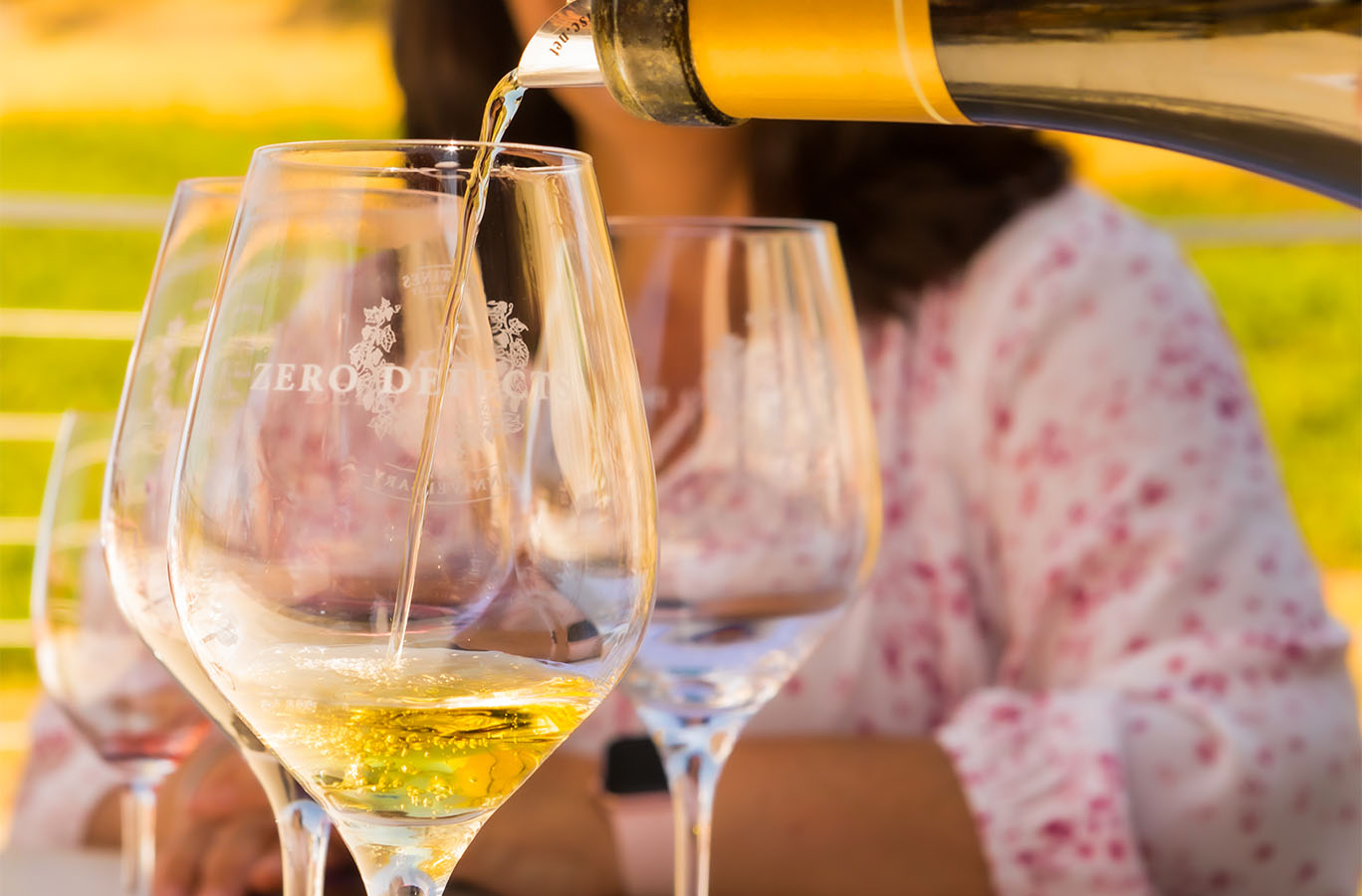 ZD Chardonnay being poured in a glass set upon a table