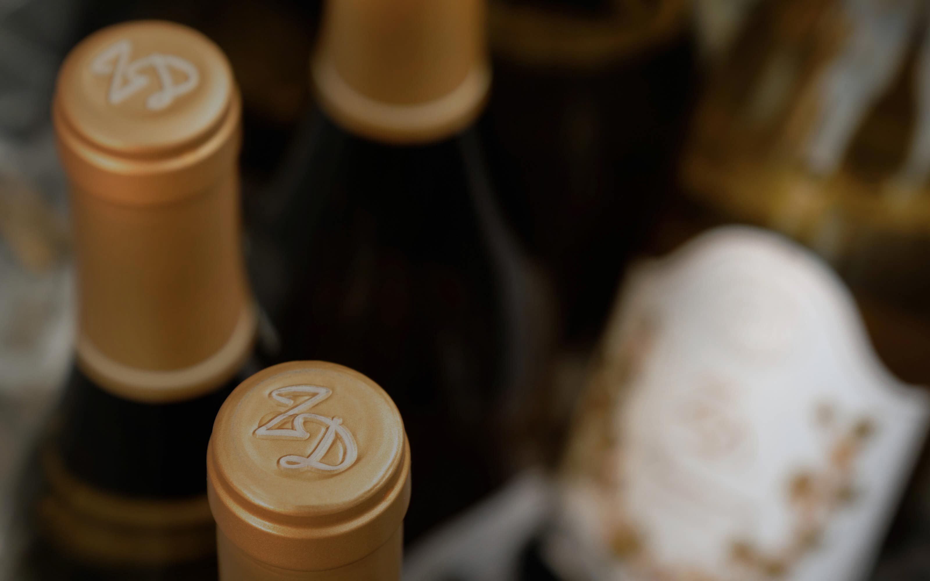 A closeup of bottles of ZD Chardonnay in an ice bucket.