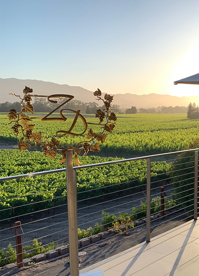 Sun setting over hills beyond the ZD Rutherford Estate.