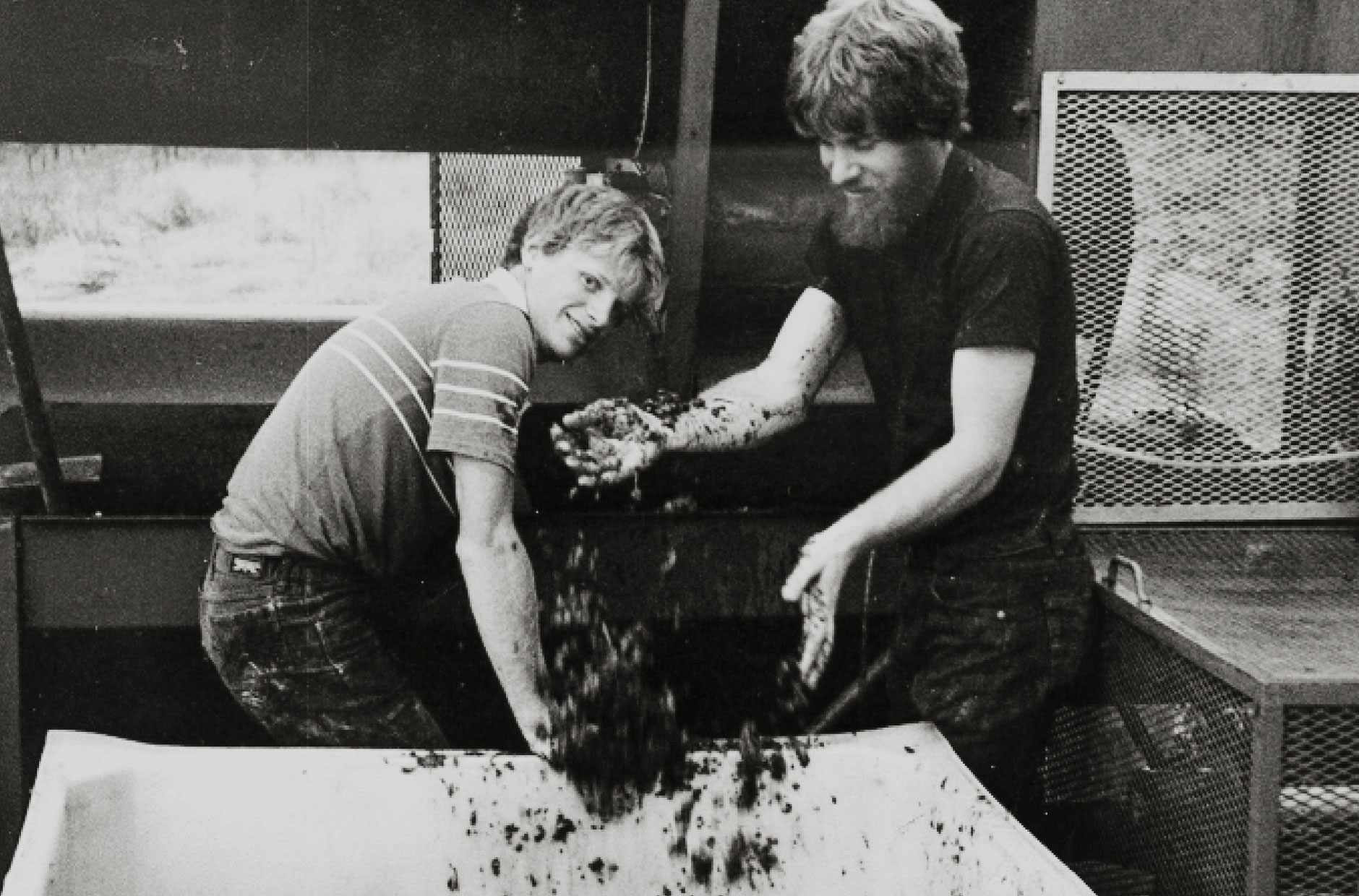 An old photo of Brett and Robert deLeuze helping with harvest.