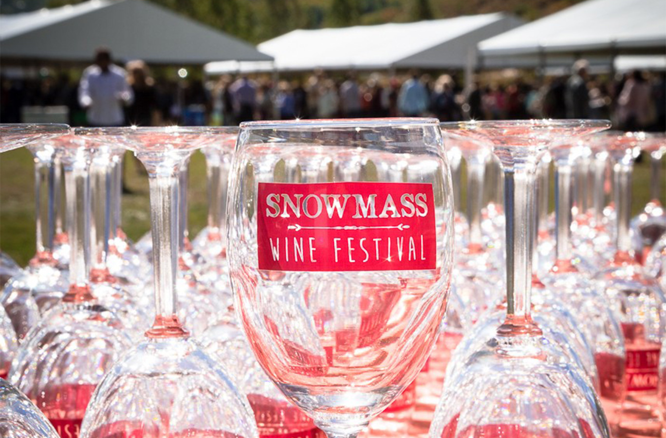 A Snowmass Wine Festival wine glass on a table
