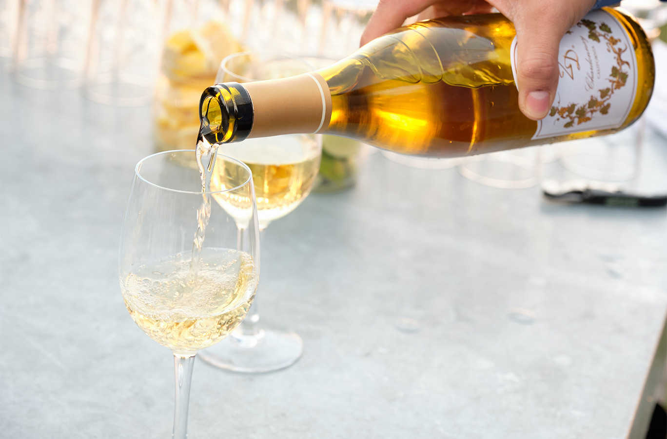 ZD Chardonnay being poured into a wine glass at an event.