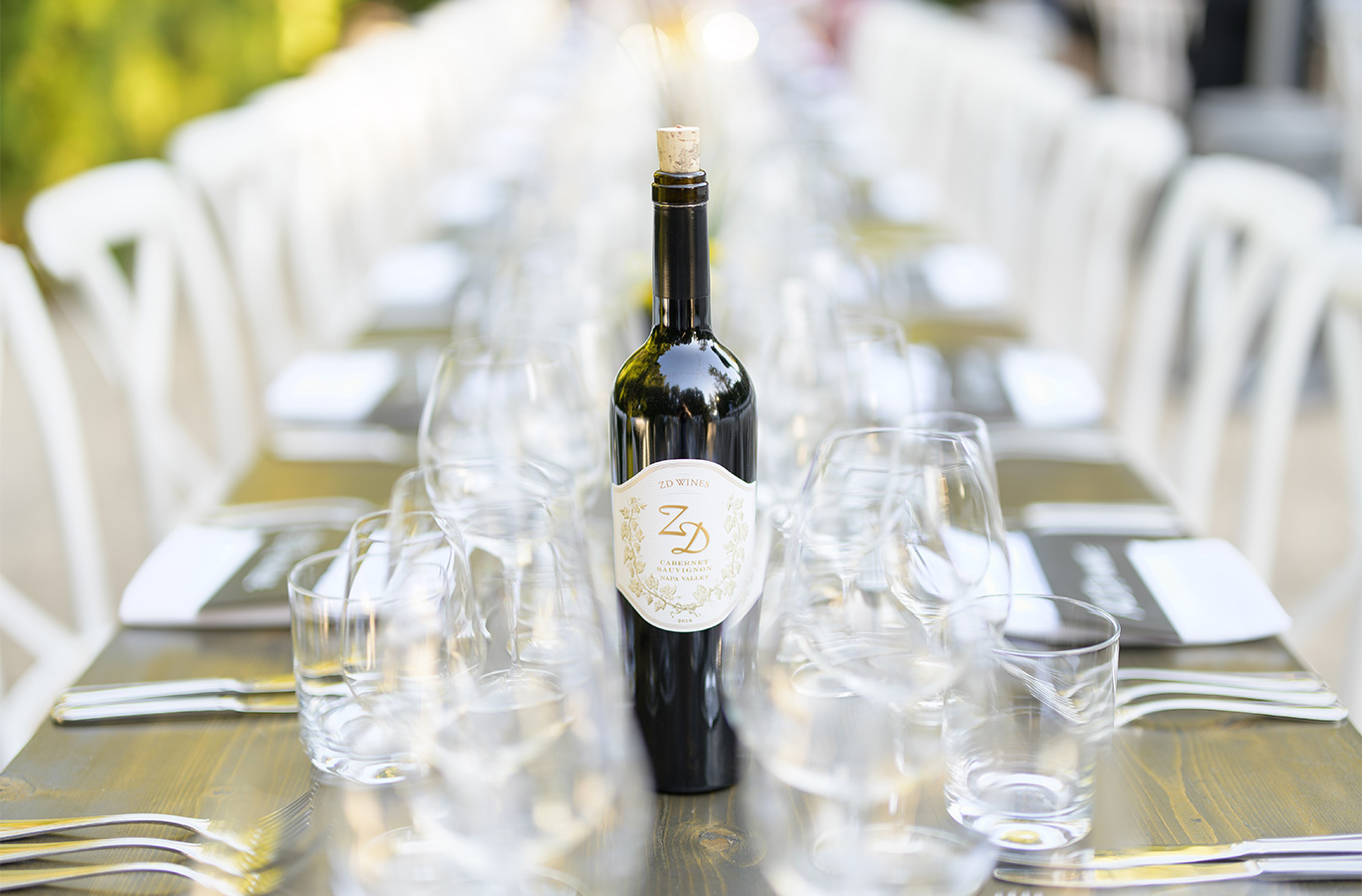 A bottle of ZD Cabernet on a table set for a dinner