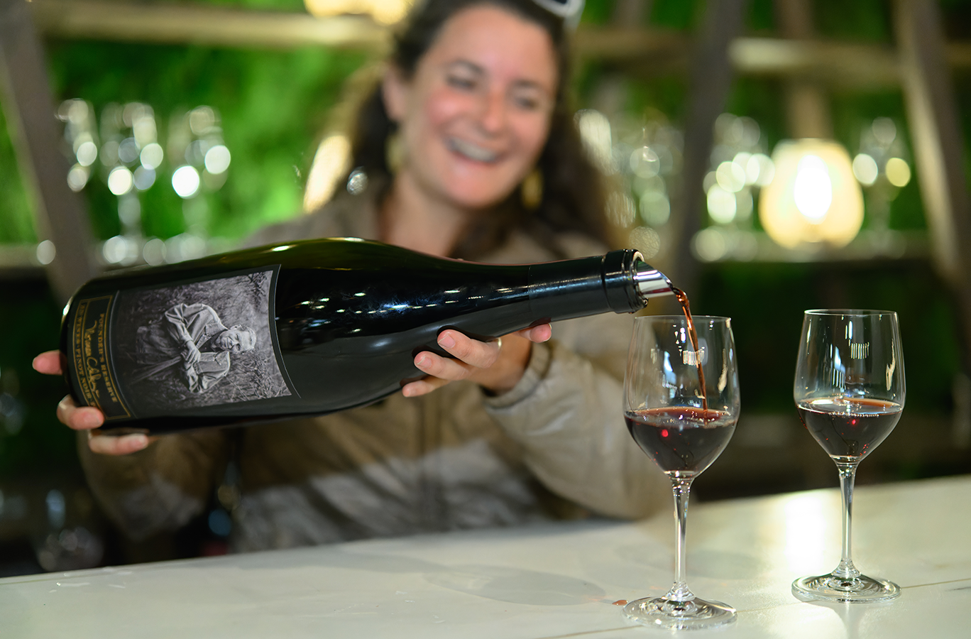 A 3-liter of Founder's Reserve Pinot Noir being poured into wine glasses